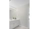 Well-lit bathroom vanity with bright lighting and neutral decor, adjacent to the doorway at 3605 Grey Abbey Dr, Alpharetta, GA 30022