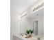 Bright, clean bathroom featuring double sinks, a modern mirror, and contemporary lighting at 3605 Grey Abbey Dr, Alpharetta, GA 30022