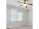 Bright bedroom with ceiling fan and window with blinds at 3605 Grey Abbey Dr, Alpharetta, GA 30022