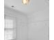 Walk-in closet featuring a window, blinds, and wire shelving at 3605 Grey Abbey Dr, Alpharetta, GA 30022