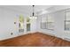 Dining area with hardwood floors, natural light and french doors to the outside at 3605 Grey Abbey Dr, Alpharetta, GA 30022