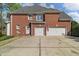 The property has a two-car garage and a spacious driveway at 3605 Grey Abbey Dr, Alpharetta, GA 30022