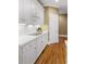 Kitchen with white cabinets, stainless appliances and hardwood floors at 3605 Grey Abbey Dr, Alpharetta, GA 30022