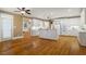 Bright kitchen with white cabinets and hardwood floors features an island and stainless steel appliances at 3605 Grey Abbey Dr, Alpharetta, GA 30022