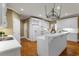 Bright kitchen with white cabinets, island, and modern appliances at 3605 Grey Abbey Dr, Alpharetta, GA 30022