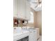Laundry room featuring white cabinets and washer and dryer units at 3605 Grey Abbey Dr, Alpharetta, GA 30022