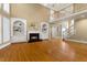 Living room showcasing a fireplace, staircase, and hardwood floors at 3605 Grey Abbey Dr, Alpharetta, GA 30022