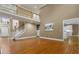 Open-concept living room showing stairs, hardwood floors, and white trim at 3605 Grey Abbey Dr, Alpharetta, GA 30022