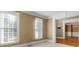 Bright living room with large windows with blinds at 3605 Grey Abbey Dr, Alpharetta, GA 30022