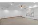 Spacious room with tile floors, recessed lights, ceiling fan and a large window at 3605 Grey Abbey Dr, Alpharetta, GA 30022