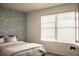 Cozy bedroom with wallpaper and natural light from a large window at 4203 Fairington Village Dr, Lithonia, GA 30038
