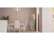 Cozy dining area features modern chandelier and neutral gray paint at 4203 Fairington Village Dr, Lithonia, GA 30038