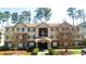 Inviting multi-Gathering home showcasing manicured lawns and warm-toned brick and siding at 4203 Fairington Village Dr, Lithonia, GA 30038