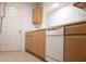 Practical kitchen with white appliances and light wood cabinetry at 4203 Fairington Village Dr, Lithonia, GA 30038