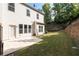 Backyard view featuring a concrete patio and a grassy yard, perfect for relaxing and entertaining at 4236 Silver Spruce Ln, Smyrna, GA 30080