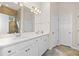 Bright bathroom with double vanity, white cabinetry, and modern fixtures for a luxurious feel at 4236 Silver Spruce Ln, Smyrna, GA 30080