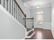 View of front door and elegant staircase in the foyer of a townhome at 4236 Silver Spruce Ln, Smyrna, GA 30080