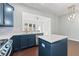 A modern kitchen featuring blue cabinets, stainless steel appliances, and a center island at 4236 Silver Spruce Ln, Smyrna, GA 30080