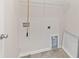 Utility Room features a laundry hookup, wall-mounted shelving, and room for storage or mechanicals at 4236 Silver Spruce Ln, Smyrna, GA 30080