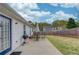 Spacious backyard featuring a patio with outdoor furniture, grill, and a lush green lawn at 1193 Colony Creek Ct, Lawrenceville, GA 30043