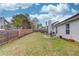 Wide view of a fenced backyard with a patio area, perfect for outdoor entertaining at 1193 Colony Creek Ct, Lawrenceville, GA 30043