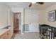 A view of a Bedroom with closet and door, ceiling fan, and dinosaur wall decor at 1193 Colony Creek Ct, Lawrenceville, GA 30043