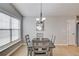 Well-lit dining area with a view of the home's backyard at 1193 Colony Creek Ct, Lawrenceville, GA 30043