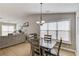 Dining area with a modern light fixture and lots of natural light at 1193 Colony Creek Ct, Lawrenceville, GA 30043