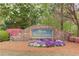 Community entrance sign with stone detail and colorful landscaping at 1193 Colony Creek Ct, Lawrenceville, GA 30043