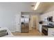 Bright kitchen features stainless steel appliances, white cabinets, and light wood flooring at 1193 Colony Creek Ct, Lawrenceville, GA 30043