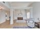 Open-concept living area with high ceilings, light-colored walls, wood floors, and stylish furnishings, creating a welcoming space at 1193 Colony Creek Ct, Lawrenceville, GA 30043
