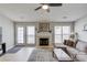 Comfortable living room with a fireplace and access to the backyard at 1193 Colony Creek Ct, Lawrenceville, GA 30043