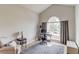 Bright home office with vaulted ceiling, large window, a comfortable chair, and a stylish desk area at 1193 Colony Creek Ct, Lawrenceville, GA 30043