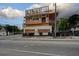 Exterior view of a building under construction with street view and construction materials at 1366 Sylvan Sw Rd, Atlanta, GA 30310