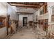 Interior view of gutted room showing exposed studs, wiring, and debris needing complete renovation at 1366 Sylvan Sw Rd, Atlanta, GA 30310