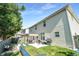 Backyard featuring a well-maintained lawn, patio seating and barbecue grill at 3798 Broadleaf Walk, Snellville, GA 30039