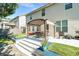 A spacious backyard patio with seating, pergola, and lush green lawn at 3798 Broadleaf Walk, Snellville, GA 30039
