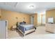 Well-lit bedroom featuring neutral carpet and full size bed at 3798 Broadleaf Walk, Snellville, GA 30039