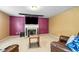 Spacious bonus room features a fireplace and a large screen for movie nights at 3798 Broadleaf Walk, Snellville, GA 30039