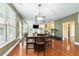 Inviting dining area with natural light and access to an adjacent living space at 3798 Broadleaf Walk, Snellville, GA 30039