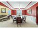 Elegant dining room with a tray ceiling, large table, and formal seating at 3798 Broadleaf Walk, Snellville, GA 30039