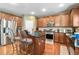 Modern kitchen featuring a center island, stainless steel appliances, and wood cabinetry at 3798 Broadleaf Walk, Snellville, GA 30039