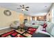 Spacious living room with neutral walls, a patterned rug, and comfortable white sofa at 3798 Broadleaf Walk, Snellville, GA 30039