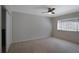 Bedroom showcasing a ceiling fan, a window, and a closet in an unfurnished space at 1445 Monroe Ne Dr # C6, Atlanta, GA 30324