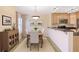 Cozy dining area featuring warm walls, a wooden table with chairs, and stylish decor and cabinetry at 1445 Monroe Ne Dr # C6, Atlanta, GA 30324