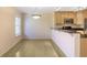 Bright dining area features a kitchen bar with granite countertops and natural light from a window at 1445 Monroe Ne Dr # C6, Atlanta, GA 30324