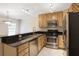 Well-appointed kitchen with stainless steel appliances, granite countertops, and ample maple-toned cabinetry at 1445 Monroe Ne Dr # C6, Atlanta, GA 30324