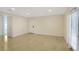 Open living room featuring neutral walls, hardwood floors, large windows, and a bright, airy feel at 1445 Monroe Ne Dr # C6, Atlanta, GA 30324