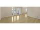 Spacious living area with hardwood floors, large windows, and French doors offering lots of natural light at 1445 Monroe Ne Dr # C6, Atlanta, GA 30324