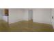 Open concept living room with hardwood floors that connects seamlessly to the kitchen area at 1445 Monroe Ne Dr # C6, Atlanta, GA 30324